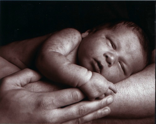Cody's newborn picture taken at the hospital in Eric's arms.