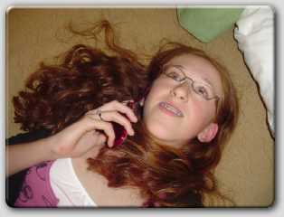 Courtney on her cell phone - gotta love girls!  :)